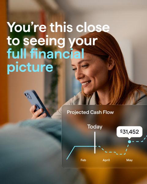 You're this close to seeing your full financial picture. A smiling woman on her phone beside a projected cash flow chart.